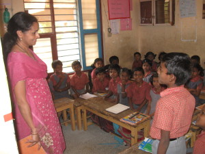 Mrs. Asha Sharma - teacher visiting from Bangalore - taking class